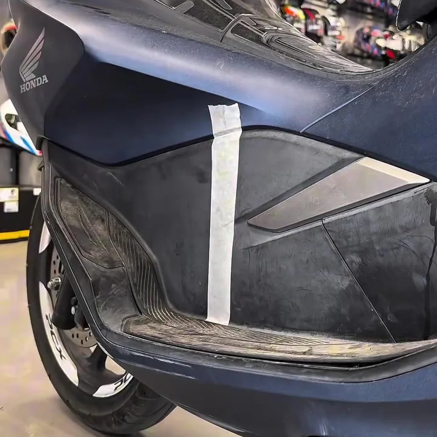 Before plastic shine: faded, grey scooter plastic panel
